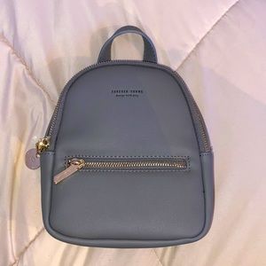 Mini bag with four pockets, great for a fashionable accessory